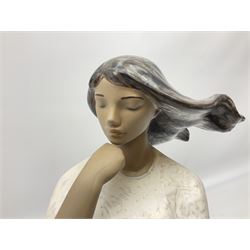 Lladro matte glazed figure, modelled as a female in contemplative post, upon naturalistically modelled 'rocky' base, H39cm