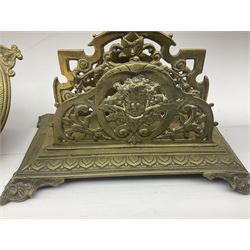 Collection of victorian and later brass desk accessories, to include a letter holder with cherub design, ink well of square form with hinged lid, brass table bell, brass casket with relief decoration, etc  