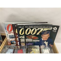 Fabbri James Bond Collection - over one hundred and ten die-cast models in perspex display cases as issued periodically; and a quantity of associated magazines and trading cards, in five boxes