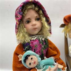 Anna Meszaros Hungary - three hand made needlework figurines - 'The Cobbler' as a child seated in a wooden rocking chair working on a removed boot H24cm; young girl standing crying holding a doll with broken head H32cm; and young girl in long dress and bonnet standing holding a doll H27cm (3)  Auctioneer's Note: Anna Meszaros came to England from her native Hungary in 1959 to marry an English businessman she met while demonstrating her art at the 1958 Brussels Exhibition. Shortly before she left for England she was awarded the title of Folk Artist Master by the Hungarian Government. Anna was a gifted painter of mainly portraits and sculptress before starting to make her figurines which are completely hand made and unique, each with a character and expression of its own. The hands, feet and face are sculptured by layering the material and pulling the features into place with needle and thread. She died in Hull in 1998.