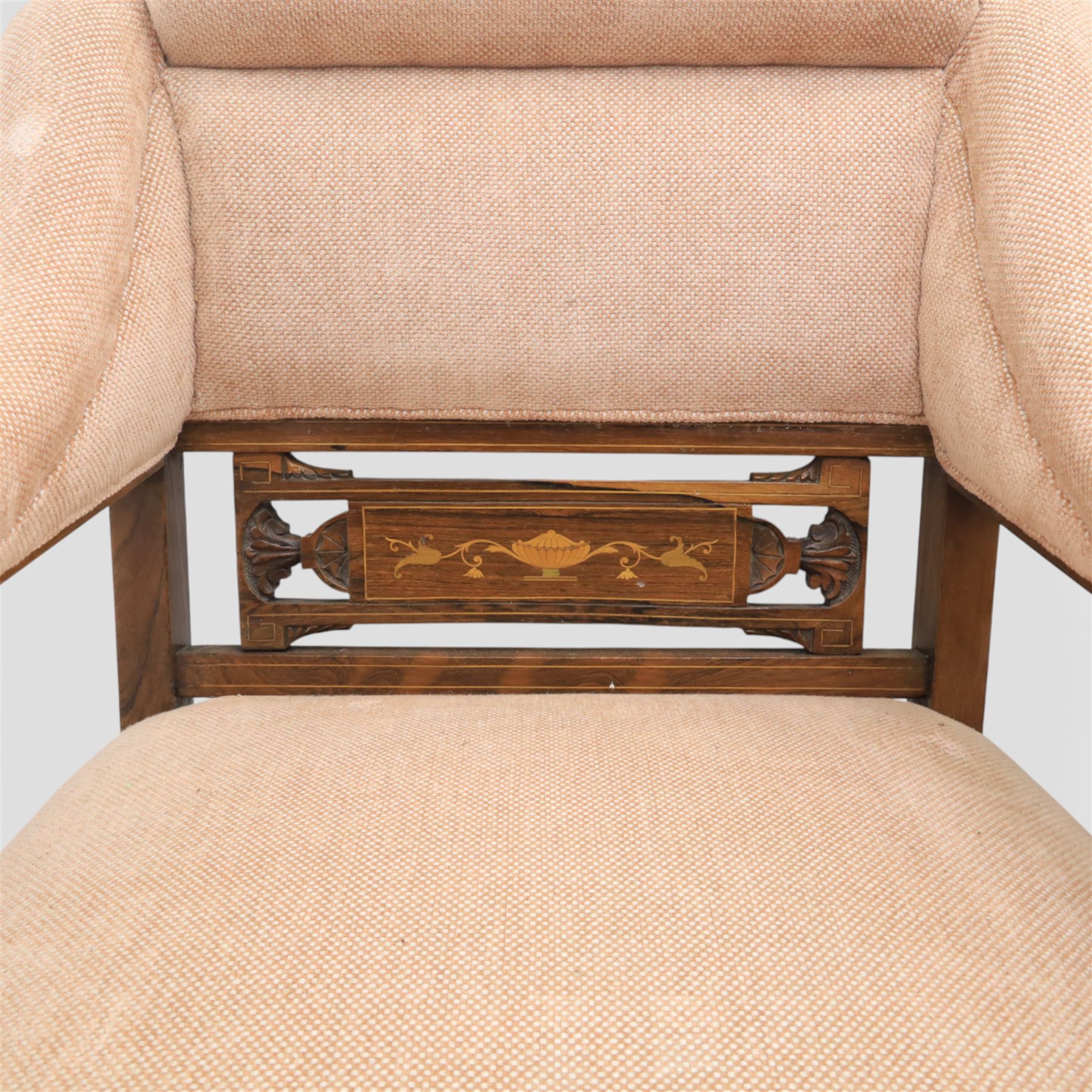 Quality Edwardian seven piece inlaid salon suite, comprising three seater settee, pair of arm chairs and four chairs with pierced splat backs, upholstered in pale pink fabric, inlaid with flowering urns, upon tapering legs with spade feet and castors