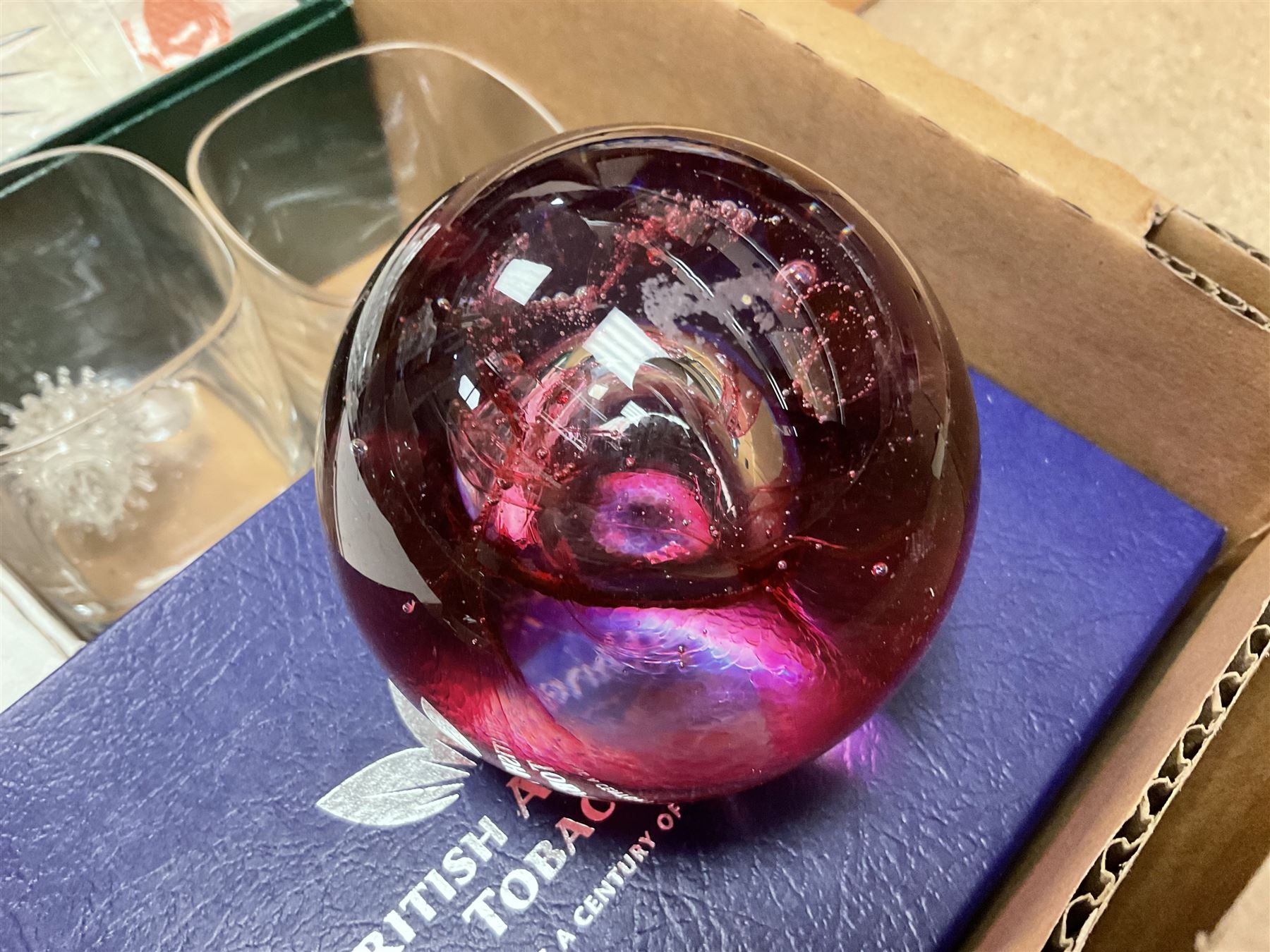 Caithness 'Fireball' paperweight, together with four cased Tyrone Crystal glasses, glass oil lamp, three glass decanters etc, in two boxes