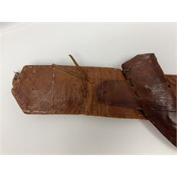 Late 19th century Yemeni Tuza jambiya as worn by religious elite, the 20.5cm curving blade with raised medial ridge, the horn hilt with pique style studwork, in a leather wrapped wooden scabbard with pierced metal mount and leather belt applied with embroidered 'gold' and 'silver' thread work panel; dagger L36cm overall, belt L84cm