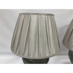 Pair of table lamps of squat baluster form, with a crackle glaze to a dark grey ground, upon a square base, including shade H57cm