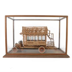 Early 20th century fretwork model of an omnibus, contained within glazed wooden case, case H45cm