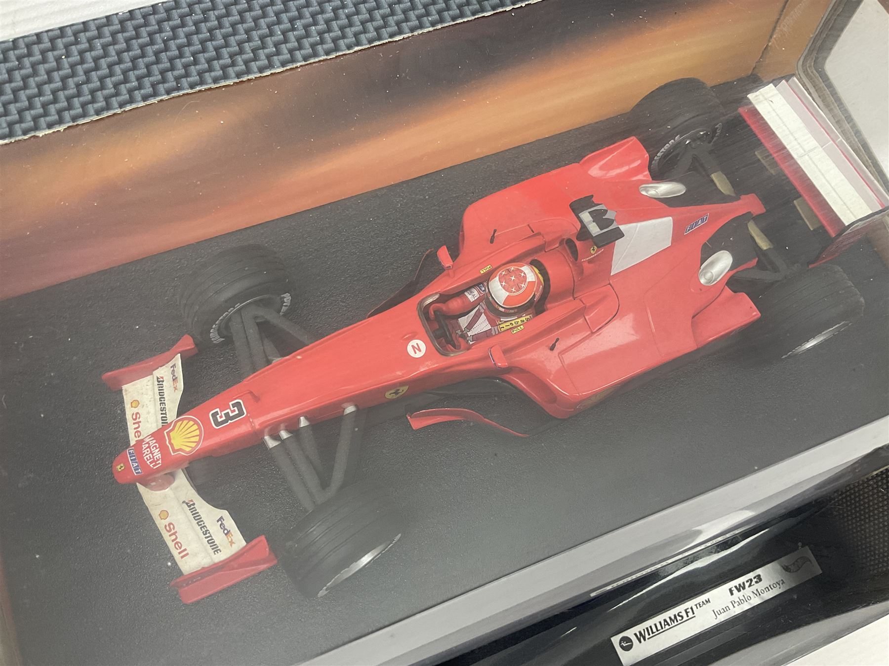 Five Mattel Hot Wheels 1:18 scale die-cast racing cars - Ferrari F1-2000 Michael Schumacher; Ferrari F-2002 Michael Schumacher; Jordan E-110 Heinz-Harald Frentzen; Williams F1 Team FW23Juan Pablo Montoya; and Ferrari F2001 Rubens Barrichello; all boxed (5)
