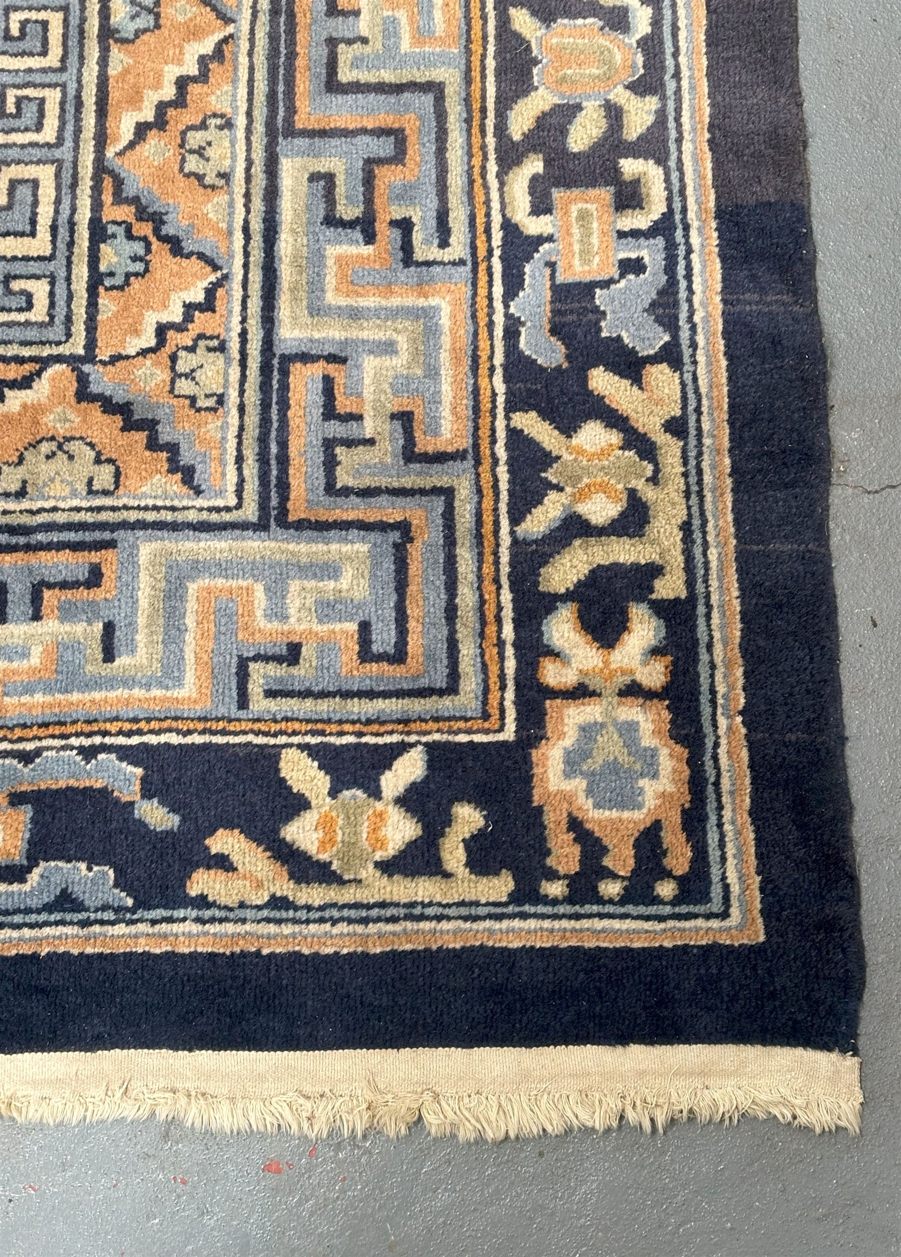 Chinese hand knotted wool carpet, first half of the 20th century, the blue field decorated with  auspicious symbols and floral motifs within multiple borders. 490cm x 363cm.  - COLLECTION BY APPOINTMENT FROM: The White House, Thirsk Road, Easingwold, York, YO61 3NF - CALL 01723 507111 TO ARRANGE