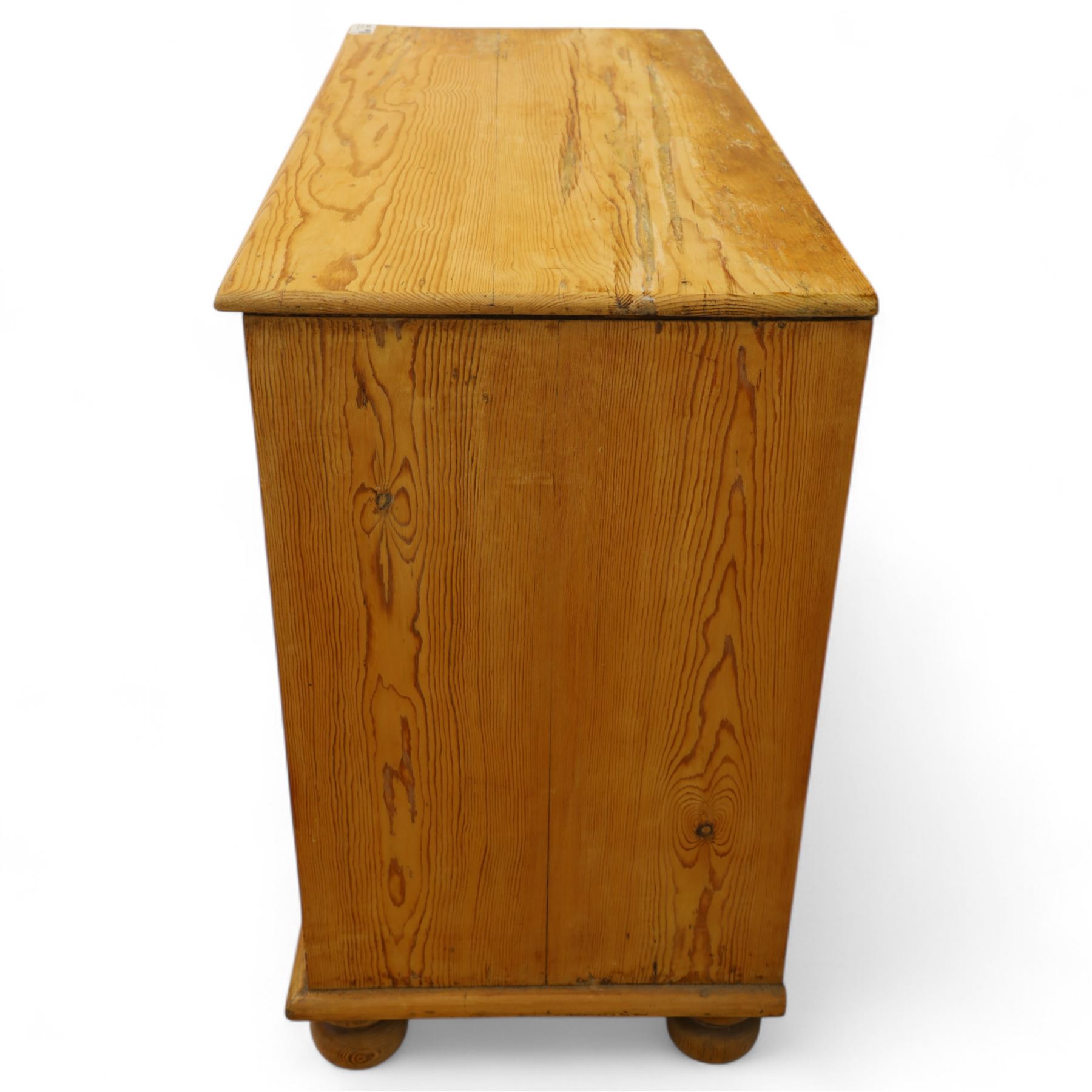 Victorian stripped pine chest, rectangular top over two short and two long drawers with turned wooden knob handles, on bun feet