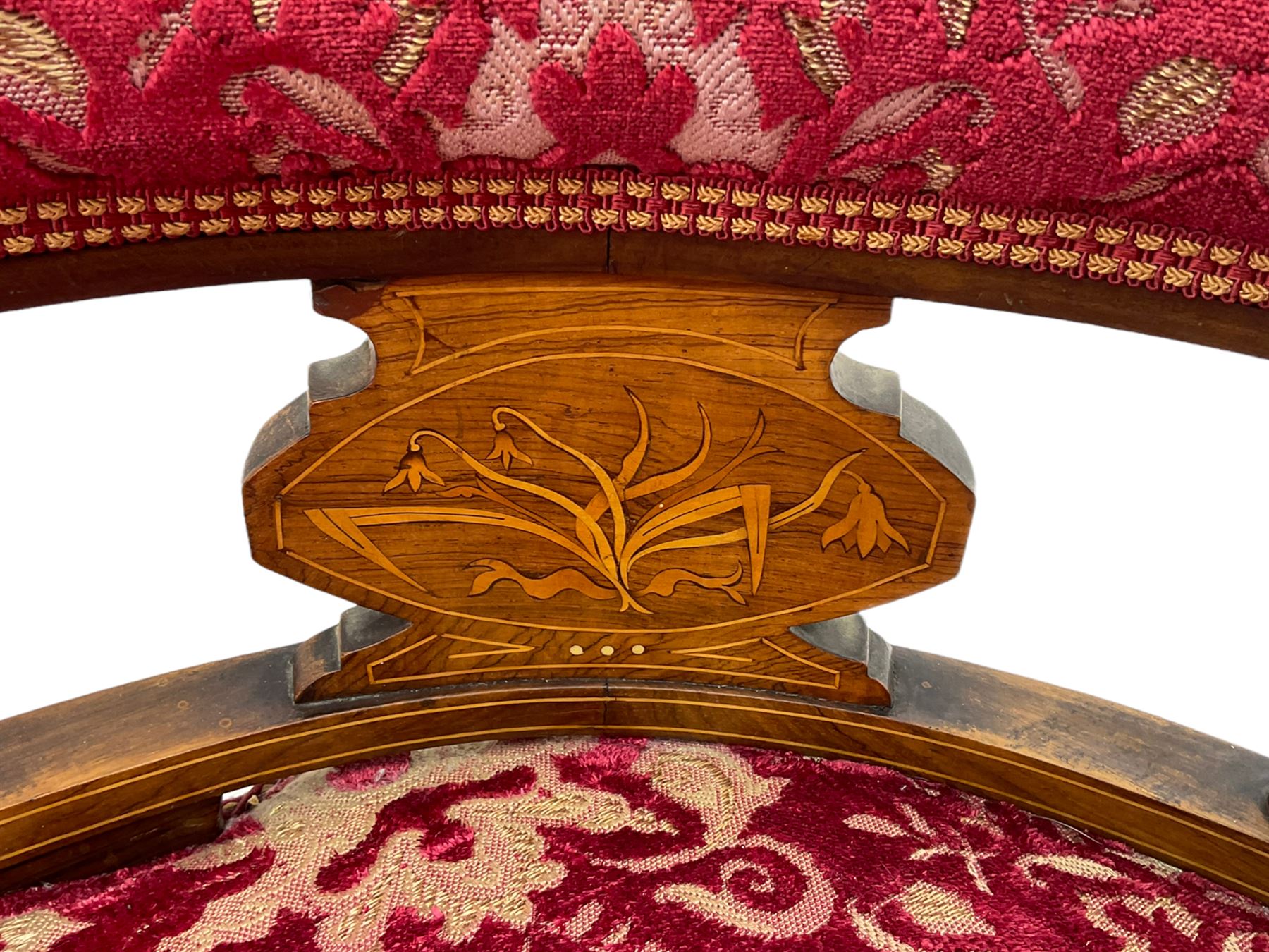 Edwardian inlaid rosewood salon suite, upholstered in red and gold fabric, comprising two seat sofa, pair of tub shaped armchairs, and four side chairs