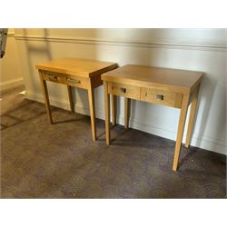 Two light oak two drawer side tables- LOT SUBJECT TO VAT ON THE HAMMER PRICE - To be collected by appointment from The Ambassador Hotel, 36-38 Esplanade, Scarborough YO11 2AY. ALL GOODS MUST BE REMOVED BY WEDNESDAY 15TH JUNE.