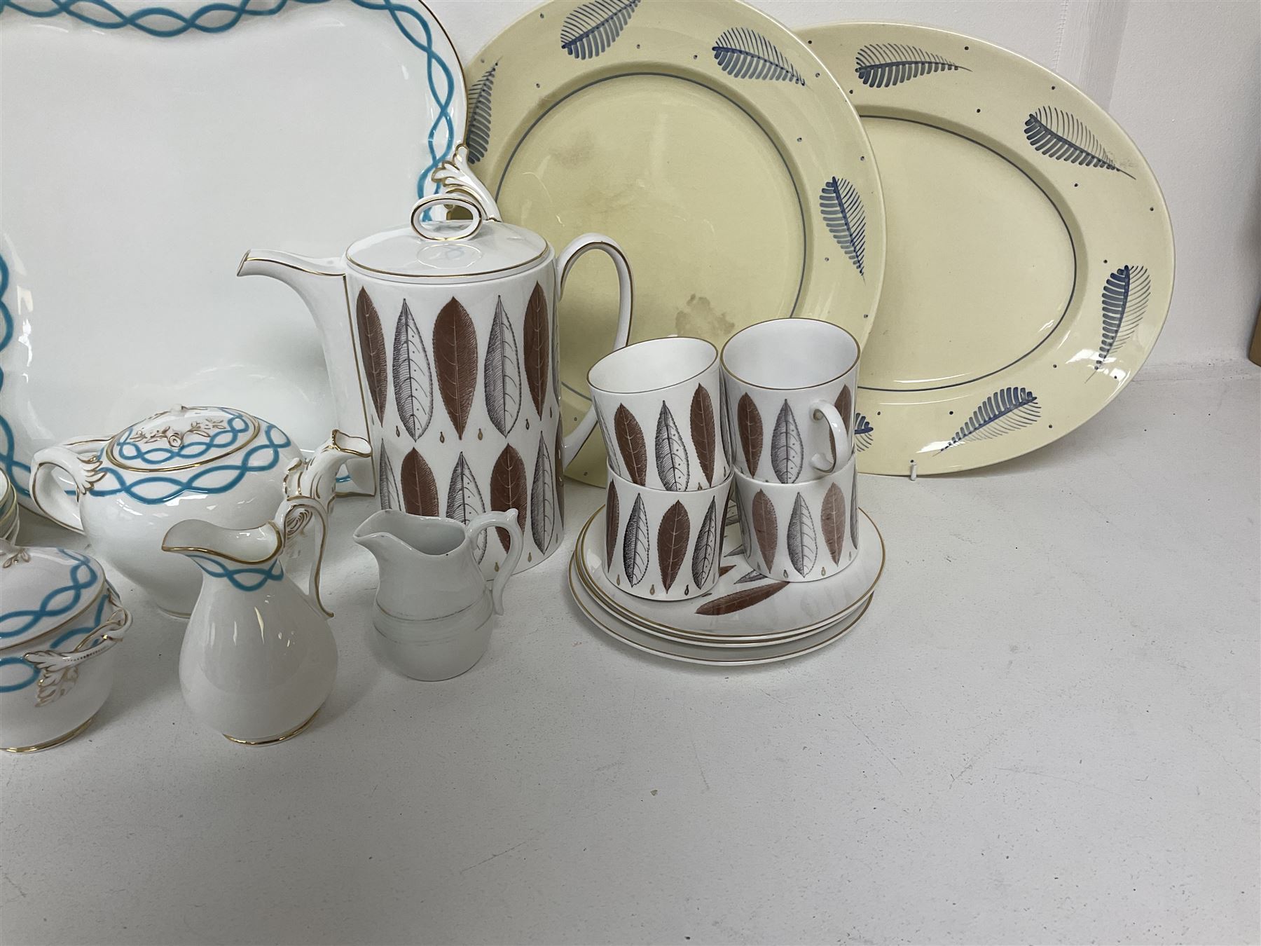 Victorian cabaret set,  comprising teapot, milk jug, covered sucrier, open sucrier, two cups and saucers upon a tray, together with Susie Cooper Hyde Park pattern coffee set, comprising coffee pot, four coffee cans and saucers, dessert plates and three plates in a similar design 