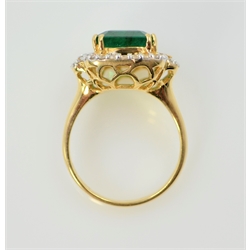  18ct emerald and diamond cluster ring, emerald approx 4.5 carat, round briliant and baguette diamonds approx 0.5 carat hallmarked  