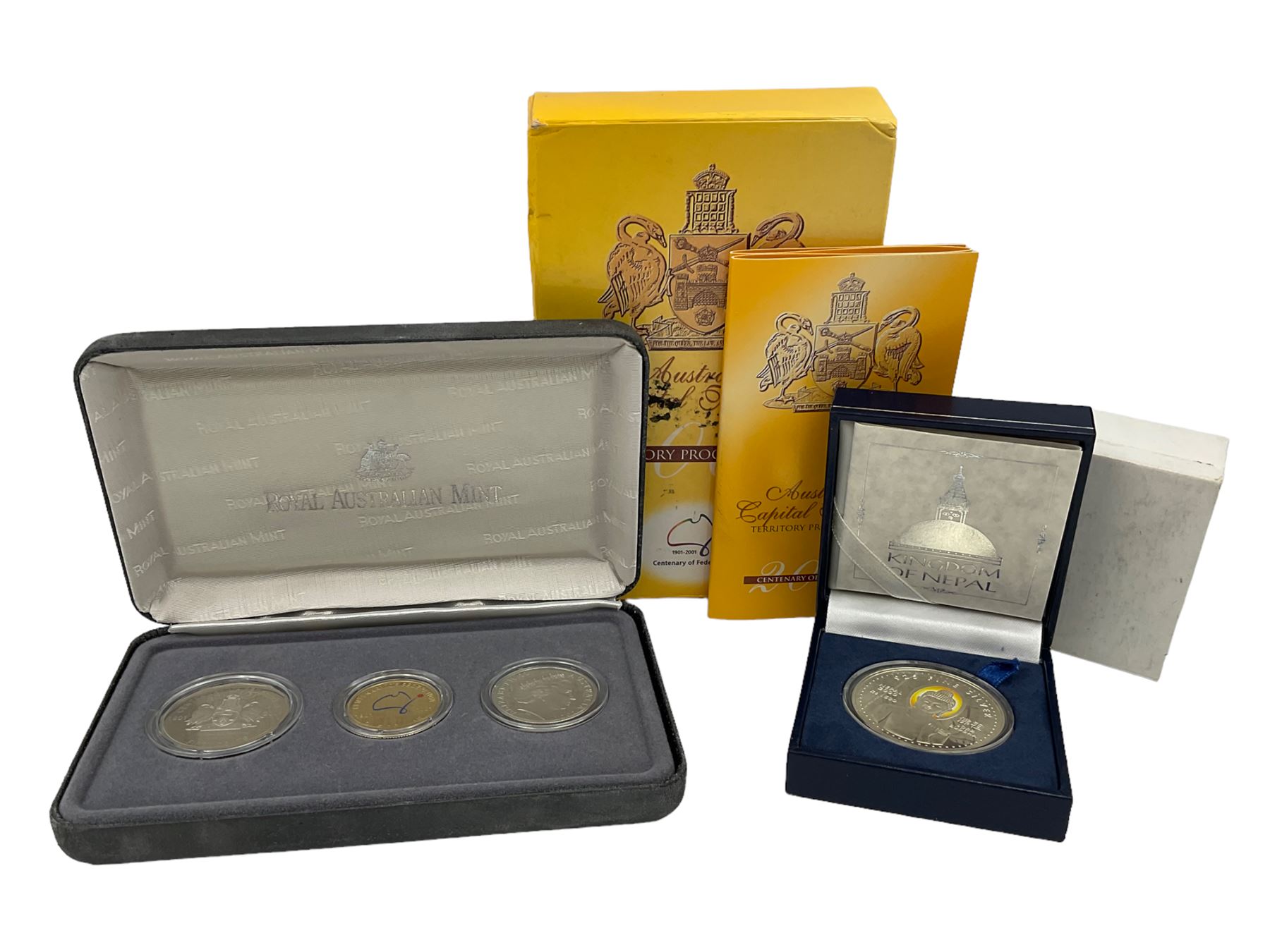 The Singapore Mint 2000 sterling silver proof one thousand five hundred Rs coin and an Australian Centenary of Federation 2001 three- coin set, both cased with certificates