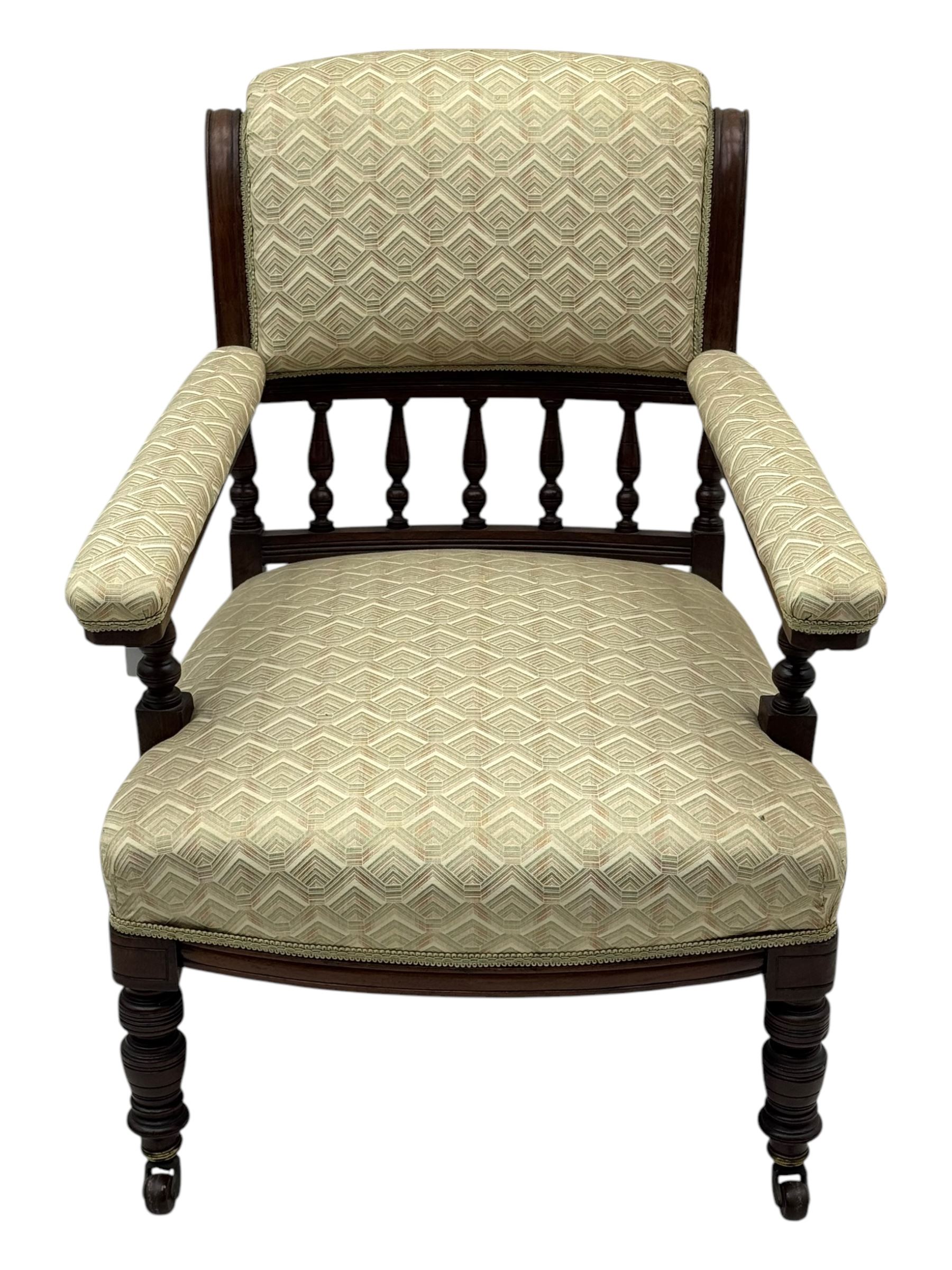 Late Victorian mahogany framed armchair, scroll back with spindle gallery, upholstered seat back and arms