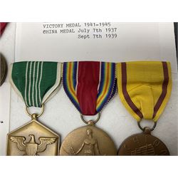 Nine American medals comprising Legion of Merit, Distinguished Flying Cross, Purple Heart named to Dick L. Sparman, Navy Good Conduct Medal, National Defence Service Medal, Army Commendation Medal, two WWII Victory Medals and China Medal; all with ribbons (9)