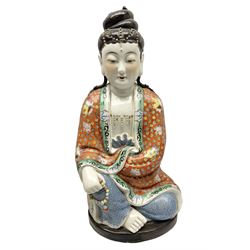 Tall Chinese polychrome figure of Guanyin (Guan Yin), the Goddess of Mercy and compassion, the Bodhisattva modelled seated and holding a rosary donning elaborate floral robes and beads, with four character seal marks beneath, H53cm