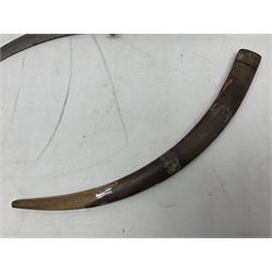 Late 19th/early 20th century Moroccan nimcha dagger-sword, the 40cm curving steel blade with engraved decoration on both sides; shaped hardwood hilt inlaid with brass, white metal wires and red coloured panels; in similarly inlaid scabbard L61cm overall