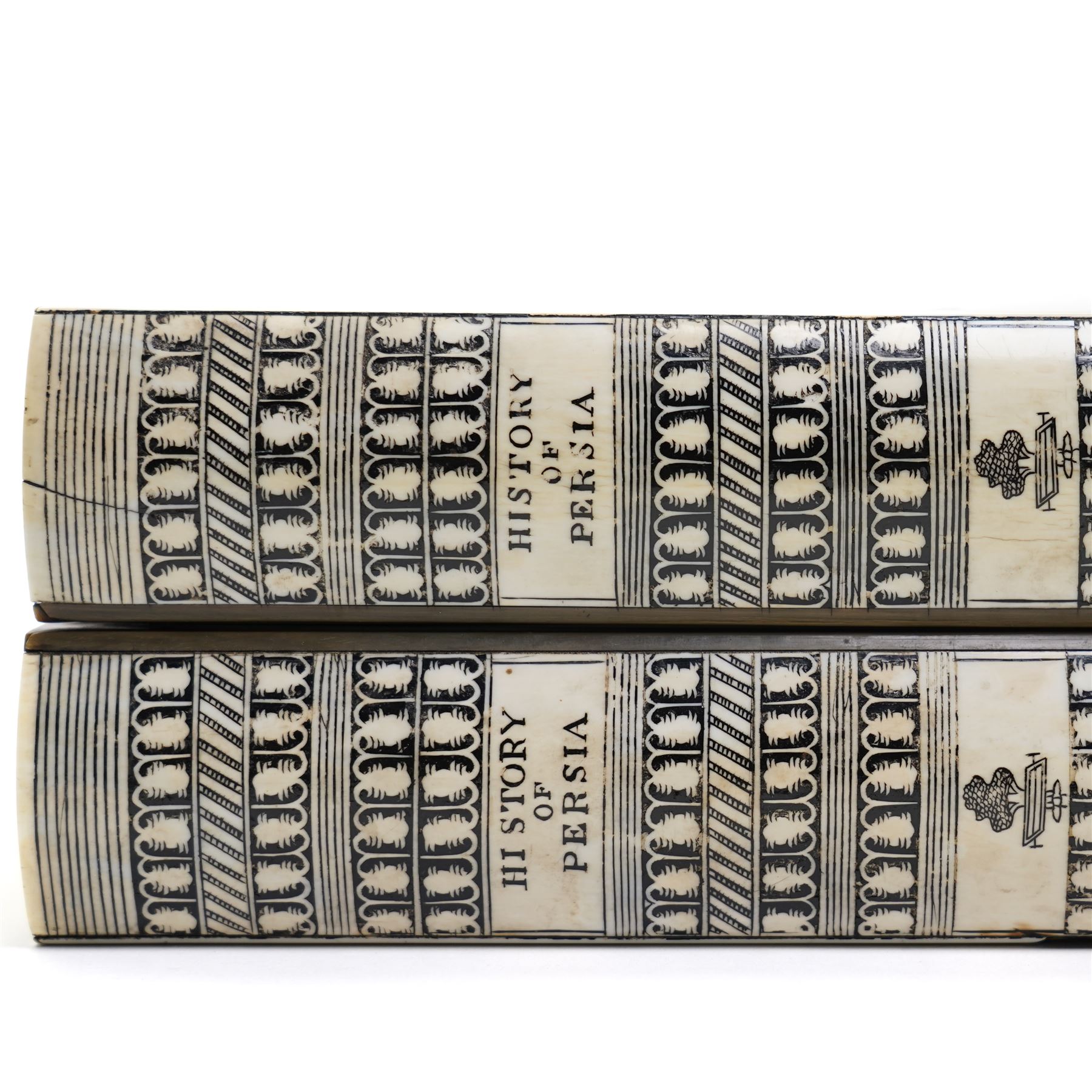 Mid-19th-century Anglo Indian Vizagapatam ivory, sandlewood, and horn veneered backgammon/chess board, circa 1860, rectangular games box the borders engraved with a stylized scrolling leaf decoration and spine engraved History of Persia the interior inlaid for backgammon, with three internal sandalwood boxes with covers, containing 16 ivory pieces and 16 horn pieces, comprising, kings and queens with pierced crowns on baluster carved shafts; bishops with carved mitres; knights represented by horses’ heads; and rooks as towers with imbricated decoration.

This item has been registered for sale under section 10 of the APHA Ivory Act, submission reference G68PNYA5 

