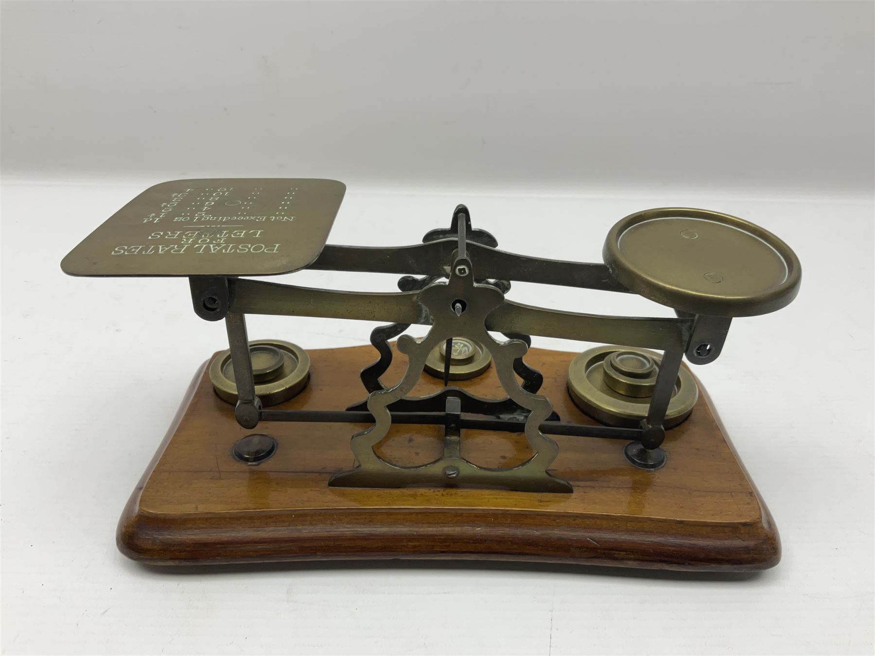 Set of brass postal scales, on wooden base