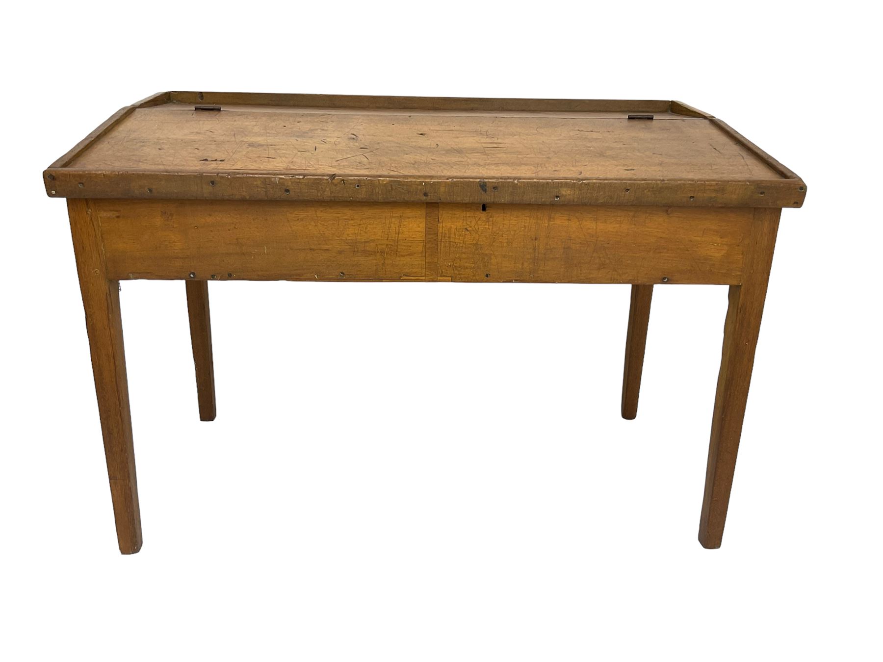 Late 19th century walnut school desk, sloped hinged lid, on square tapering supports 