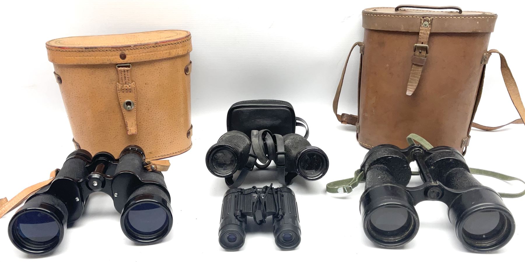Pair of British World War Two issue black-painted binoculars, Bino 7x50 No. 5, 6E/320, No. 87412, MoD.B/42, with case, together with Nipole 10 x 50 binoculars and two other pairs