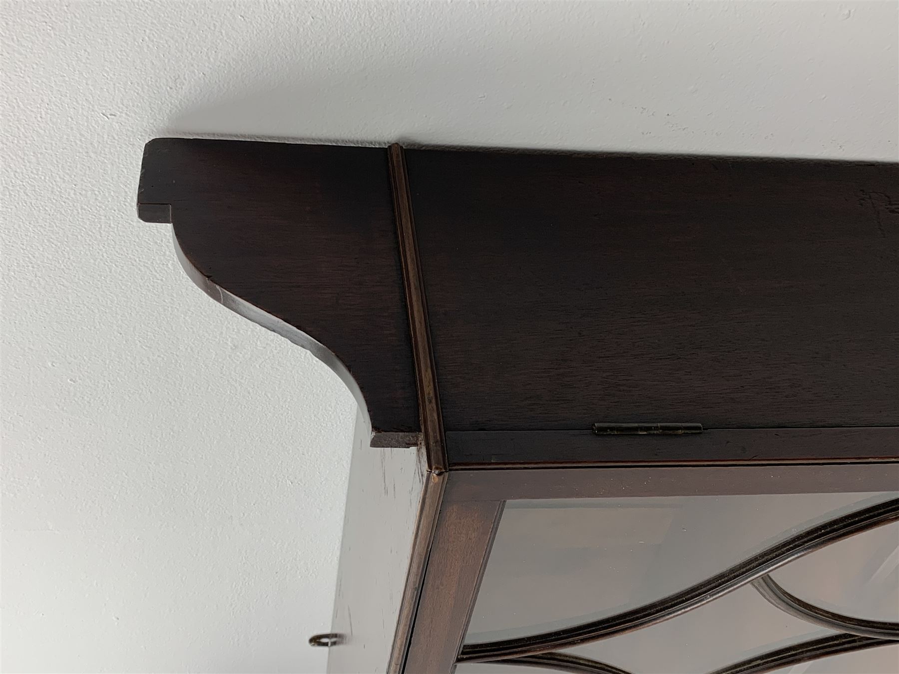 Georgian mahogany Gothic wall hanging cabinet, enclosed by two ogee pointed arch astragal glazed doors, plain sides with shaped top and bottom brackets