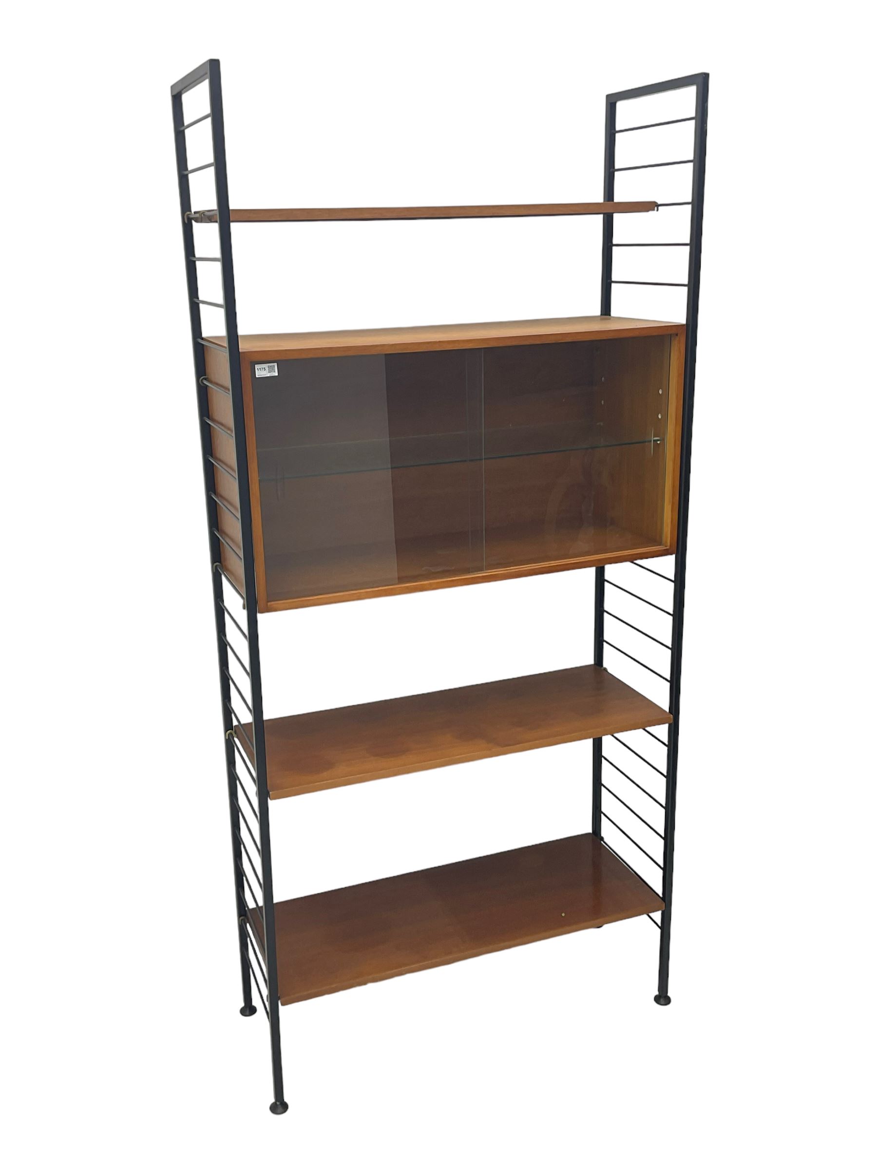 Staples Ladderax - mid-20th century teak and metal framed modular wall unit, fitted with central cupboard, the sliding glazed doors enclosing single shelf, flanked by three adjustable shelves 
