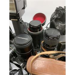 Vintage cameras lenses and accessories including Olympus 'OM10' camera body, Olympus 'OM4' camera, 'Olympus OM-System Zuiko auto-zoom 35-70mm 1:4' lens, various other lenses, tasco binoculars etc, in one box