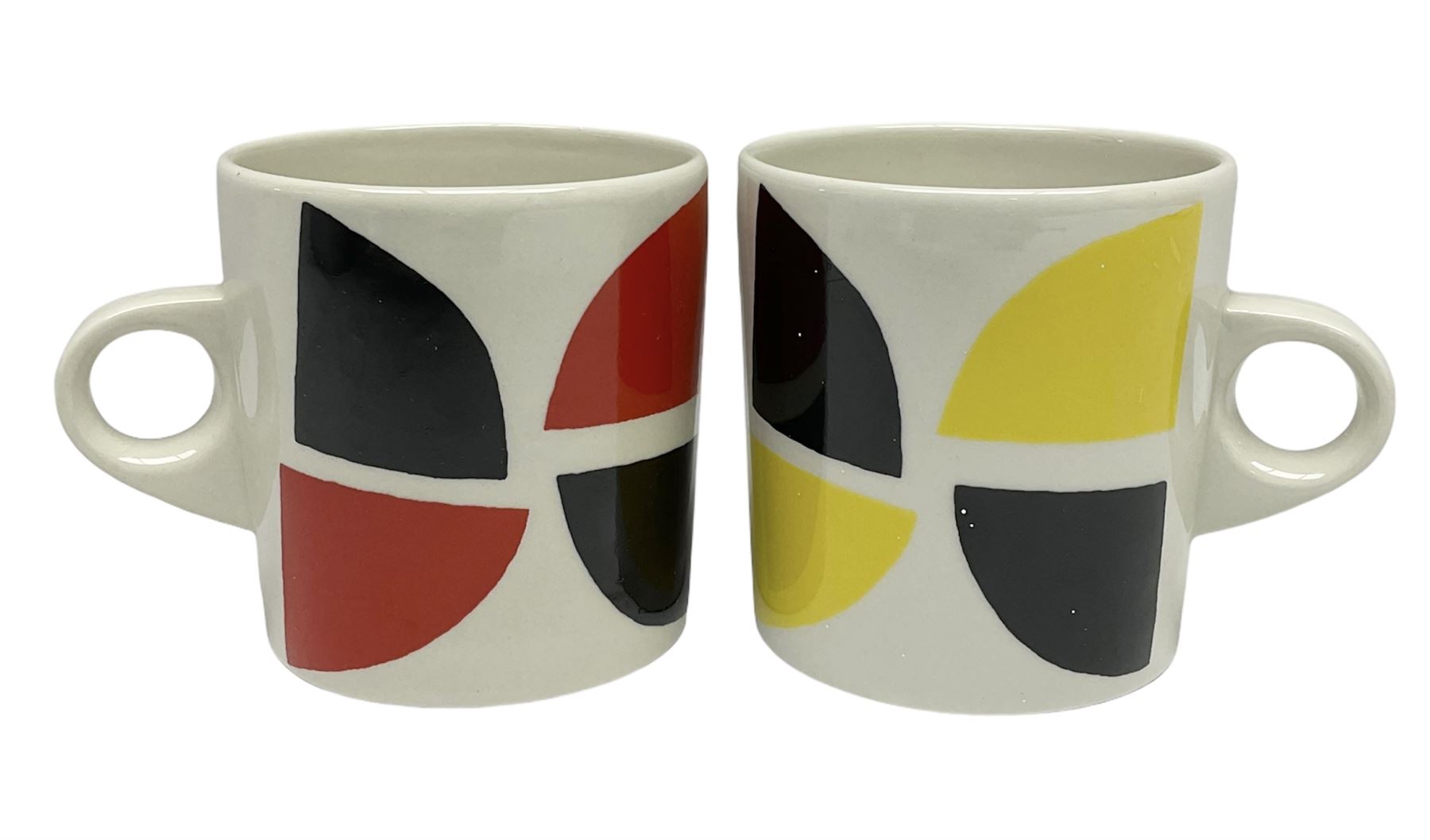 Sir Terry Frost (British 1915-2003): Two earthenware mugs, white glaze with geometric design, one yellow and black colourway, the other red and black colourway H8.3cm (2)