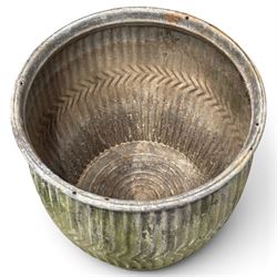Two20th century galvanised metal dolly tubs, with rolled rims above corrugated bodies centred by chevron bands and circular bases, max W48cm H52cm)