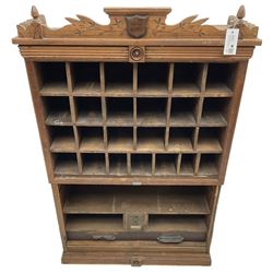 19th century stained pitch pine 'US Mail' pigeonhole unit, raised carved gallery with applied inscribed shield plaque, fitted with twenty five pigeon holes over shelves and correspondence drawers