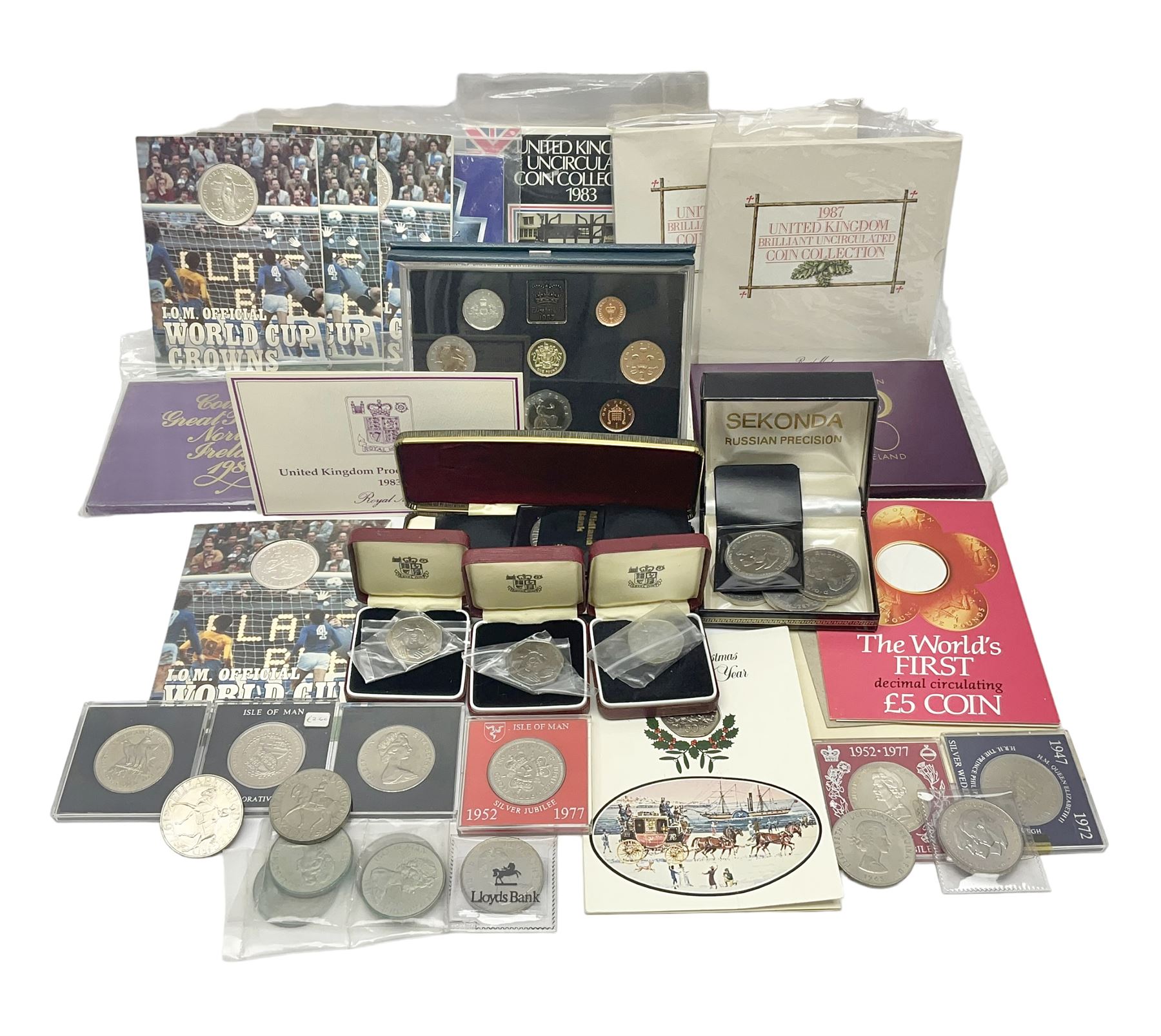 The Royal Mint United Kingdom 1983 proof coin collection in blue folder with certificate, 1983 uncirculated coin collection, two 1987 brilliant uncirculated coin collections, commemorative crowns etc