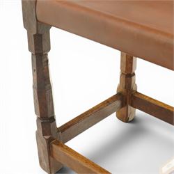 Mouseman - 1940s dark oak dressing table stool, the rectangular top with deep-tan leather seat, raised on octagonal supports united by box stretcher, with carved mouse signature, by the workshop of Robert Thompson of Kilburn