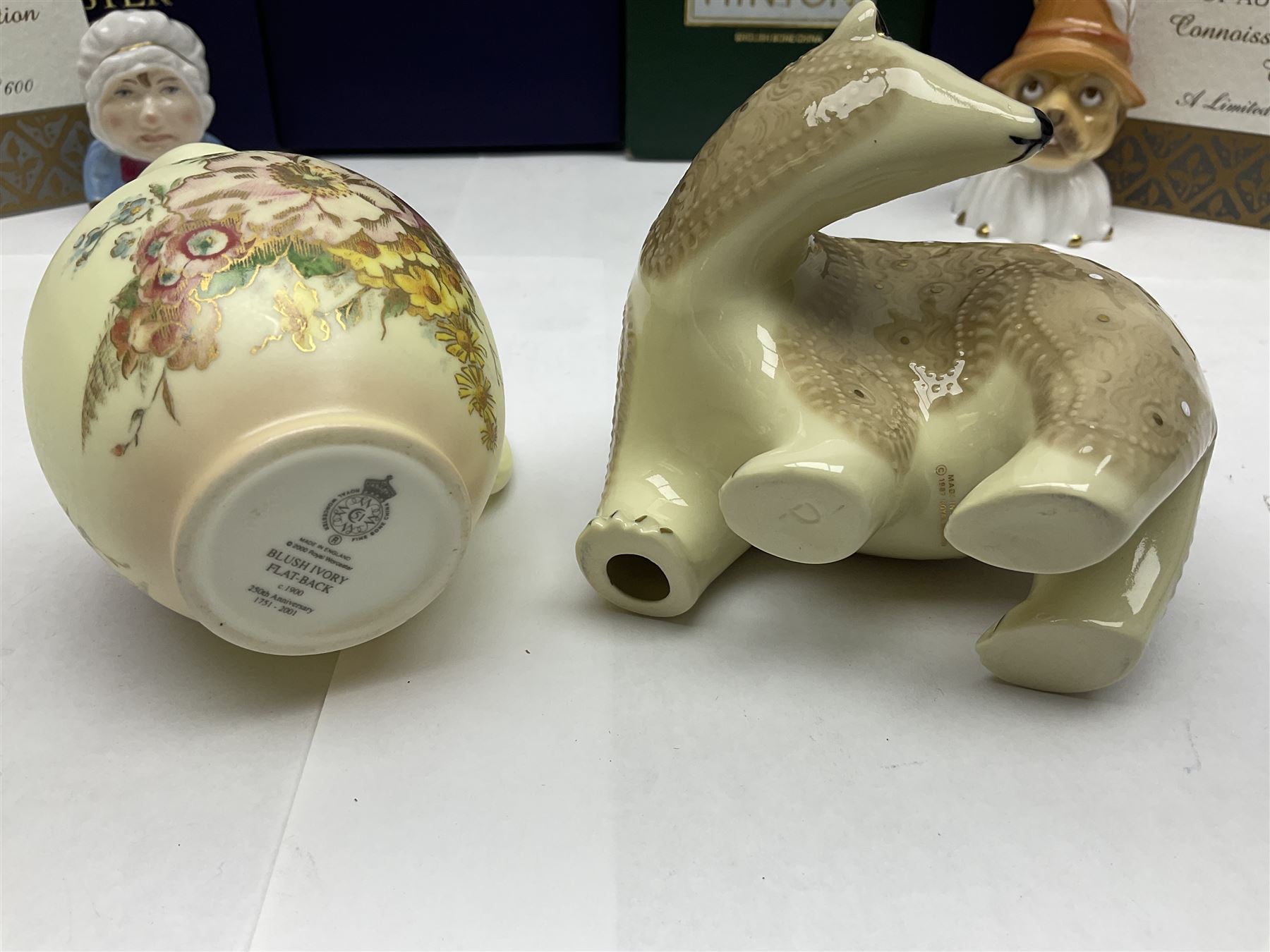 Two Royal Worcester candle snuffers from the connoisseur collection, comprising of Baby and Toby, together with Minton Fawn on Ivory Polar Bear and one other, all with original boxes 