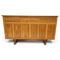 Beaverman - 1980s adzed oak sideboard raised on a trestle base, three drawers over three cupboards with Yorkshire Rose carved handles, fielded panelled sides and front, with carved Beaver, by Colin Almack of Sutton near Thirsk