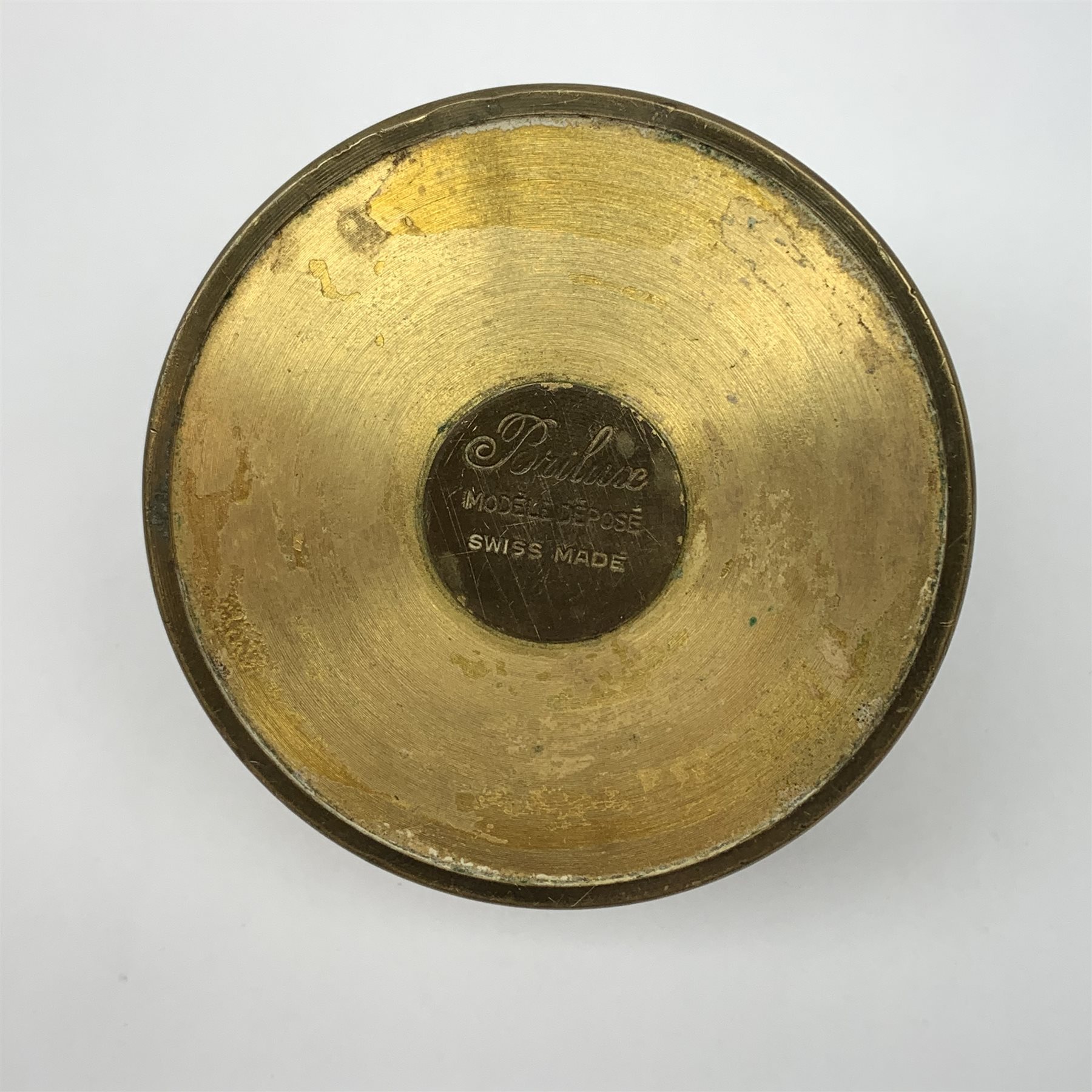 A Brilux Modele Depose Art Deco style brass table lighter, of cylindrical form with concentric ribbed decorated, marked beneath, H6cm. 