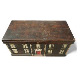Georgian style painted wooden country house box, the rectangular hinged lid enclosing a plain interior, the exterior decorated as a symmetrical Georgian facade with sash windows, and central stepped and pedimented doorway, with moulded base and top edge