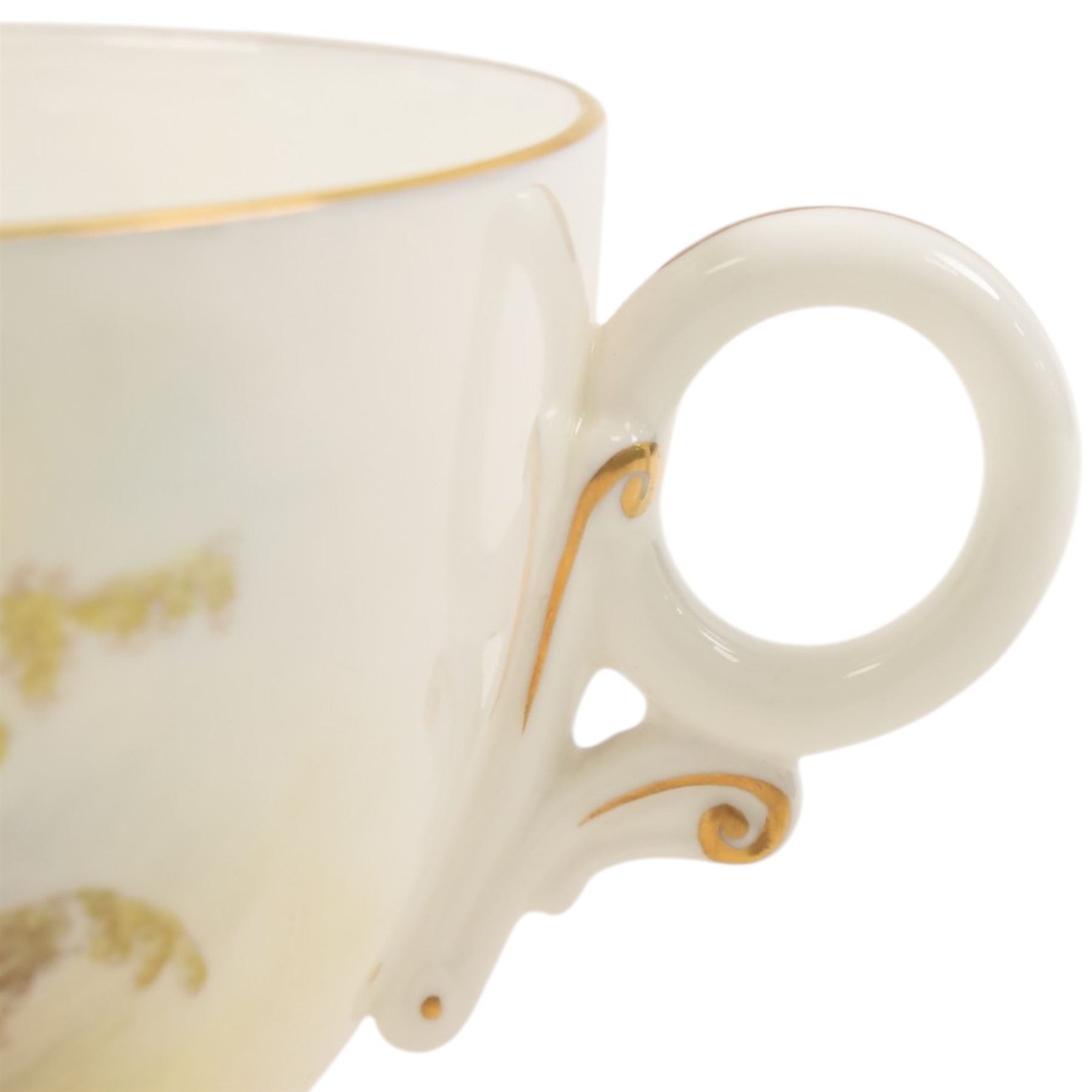 Royal Worcester large novelty cup and saucer, each hand pained, the cup with grouse, the saucer with stonechat