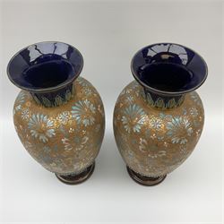 Pair Doulton Lambeth Slaters Patent vases of ovoid form, decorated with a floral and gilt band upon a dark blue ground, with impressed marks beneath, approx H34.5cm