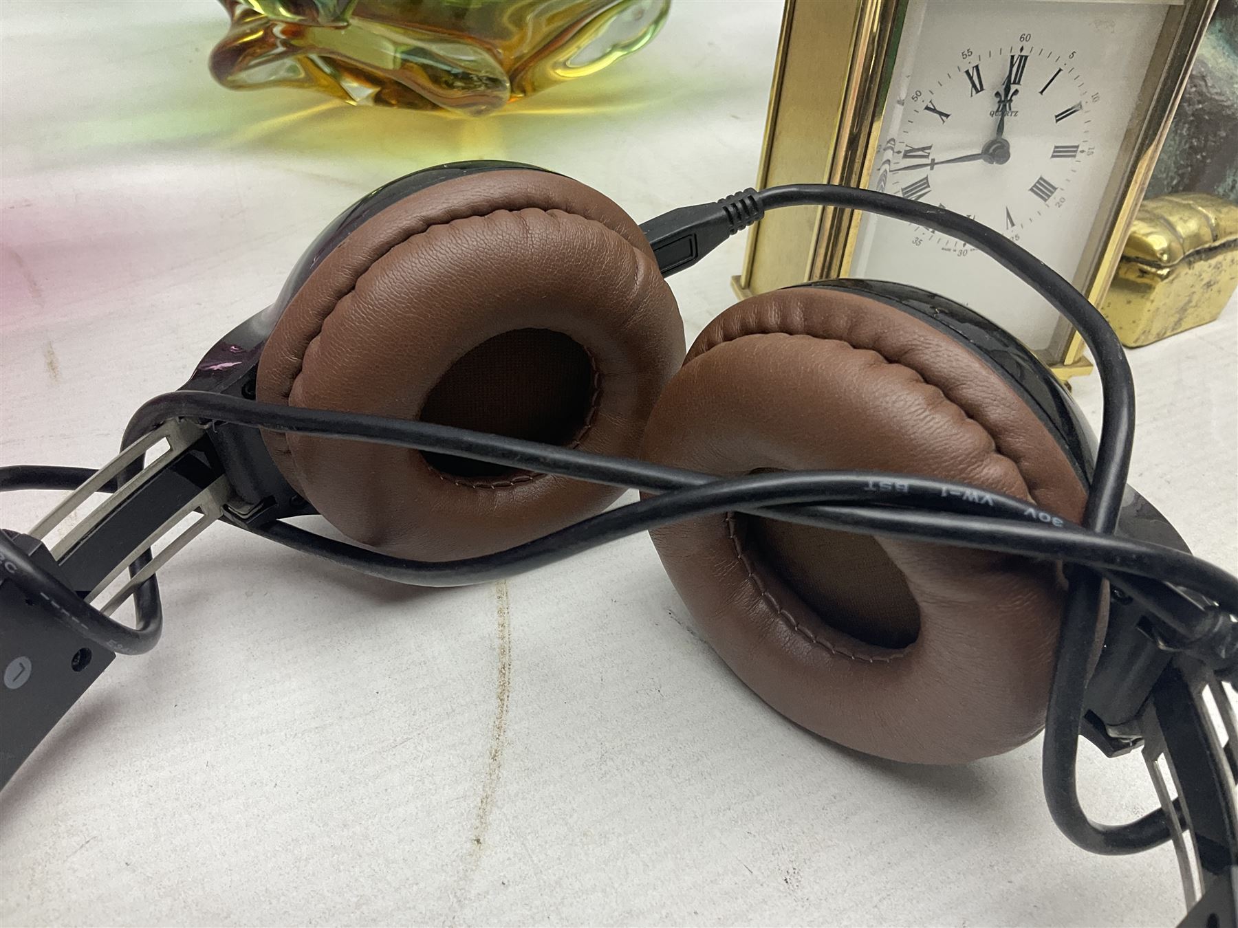 Metamec and H. Samuel battery operated brass carriage clocks, bronzed style abstract figure signed 'Cotp W', two art glass splash bowls, etc