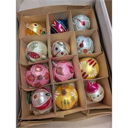 Collection of colourful vintage Christmas decorations, including glass and metal baubles