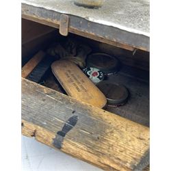 Cherry Blossom Shoe Polish shoe shine box, of sloping form, with three pictorial enamel panels advertising dark tan, black and light tan polishes, the reverse with a hinged compartment, the top mounted with a handle and foot rest in the form of a shoe sole, H29cm W42cm D33cm