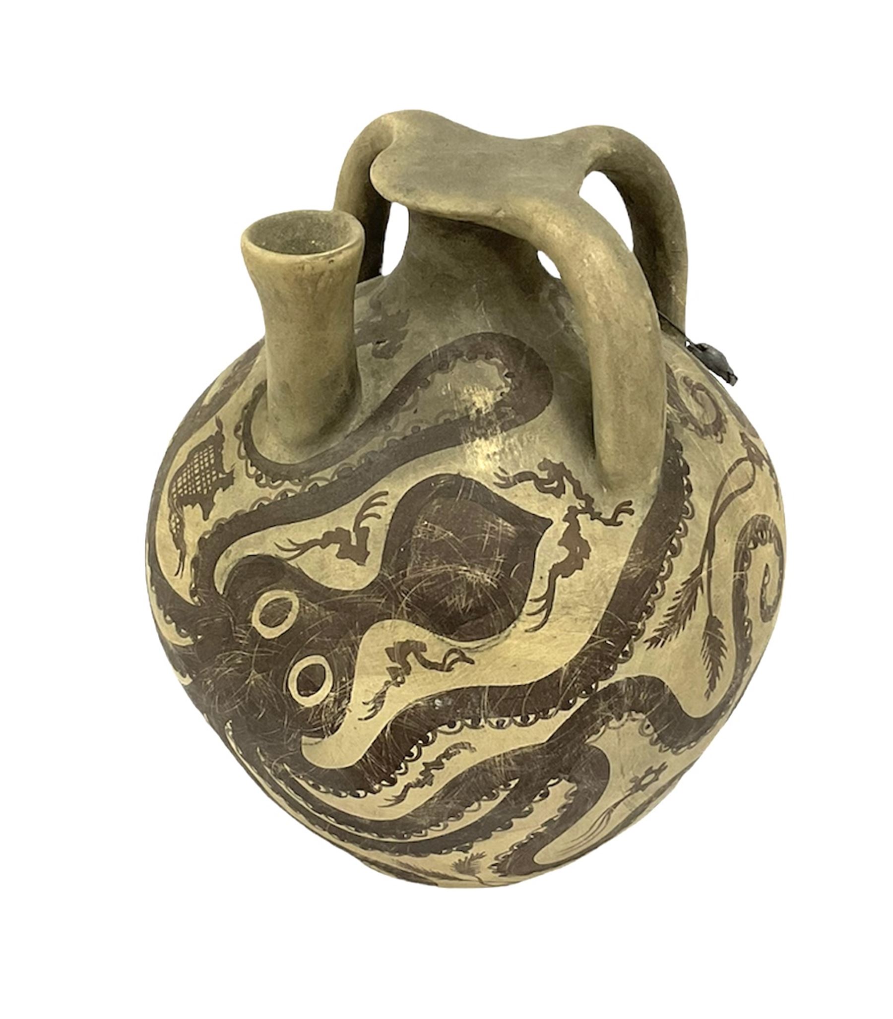 Reproduction Ancient Greek vessel in the style of Crete Minoan period, decorated with marine style ocotopi, with three handles and spout, signed beneath, H20cm