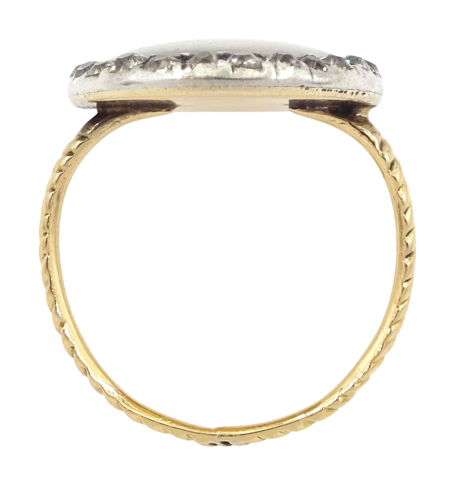 18th/ 19th century gold diamond portrait ring, set with an oval miniature of a woman on ivory, under a glazed panel, with old cut diamond surround and rope twist shank. This lot has been registered for sale under Section 10 of the APHA Ivory Act