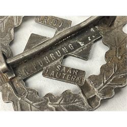 Two WW2 German Sports badges - SA sports badge marked verso 'W.Redo Eigentum D. Obersten SA. Fuhrung Saar Lautern'; and DRL sports badge marked verso 'Wernstein Jena D.R.G.M. 35269' (2)