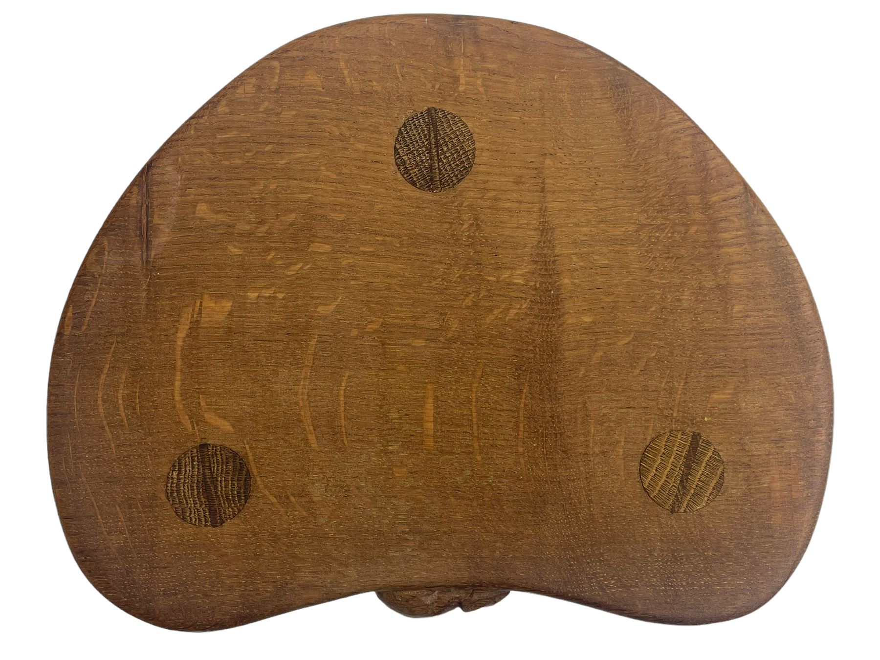 'Mouseman' oak three-legged stool, kidney shaped dished seat carved with mouse signature to edge, by Robert Thomas of Kilburn
