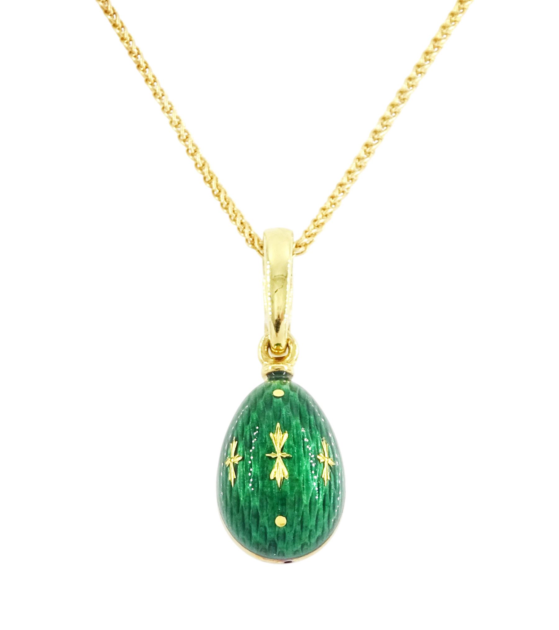 Fabergé 18ct gold enamel egg pendant, Ref. F-1310, green guilloche enamel egg, with hinged bail, designed by Victor Mayer for Fabergé, on 18ct gold wheat chain necklace, boxed with papers