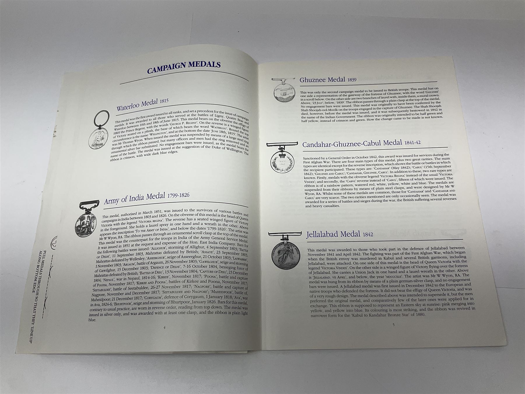 Limited edition large framed display board with sixty half-size copies of British Gallantry and Campaign Medals produced by Danbury Mint; all with ribbons and associated booklet