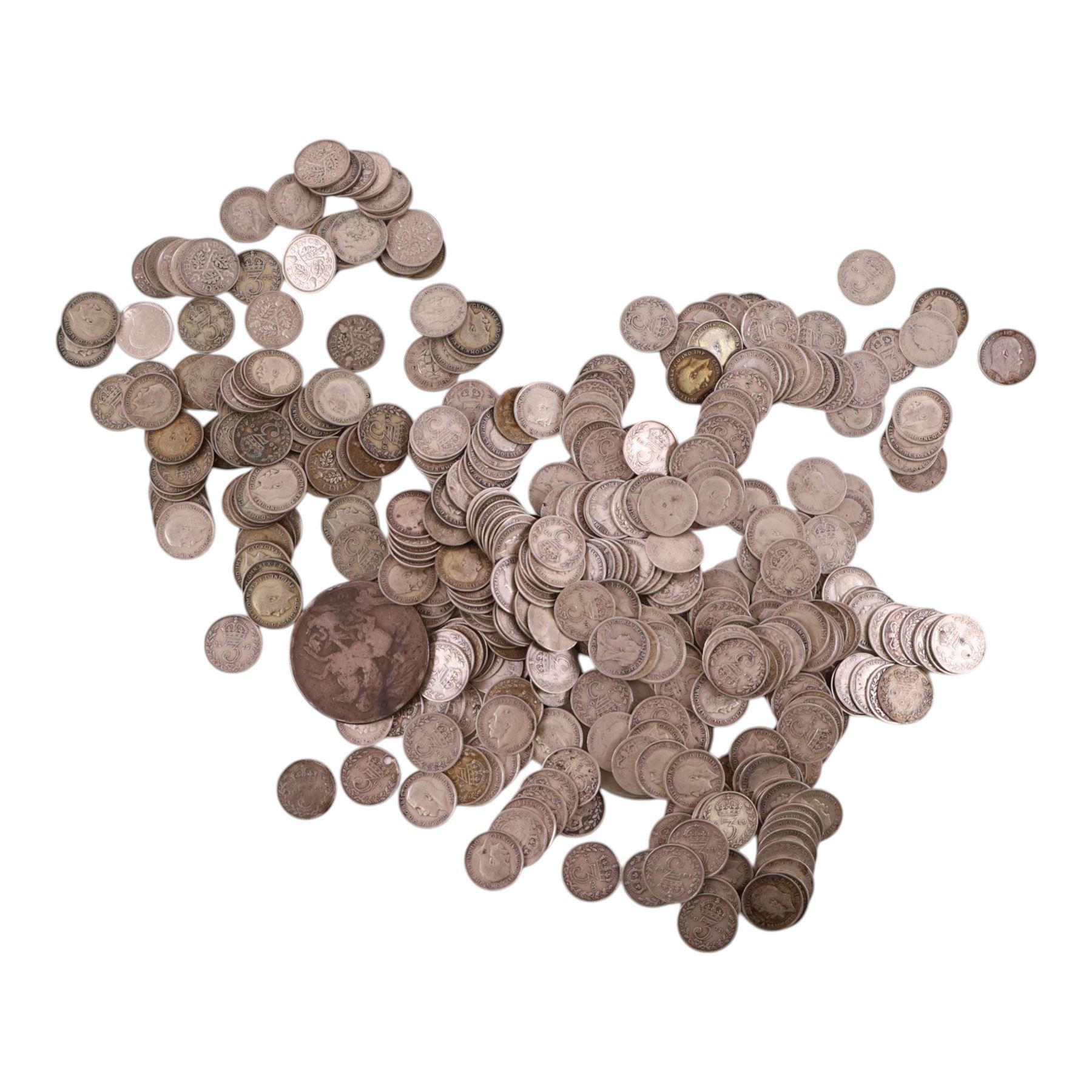 Approximately 418 grams of Great British pre-1920 and approximately 300 grams of Great British pre-1947 silver threepence coins, together with a Queen Victoria 1890 silver one crown coin and a Queen Elizabeth II 1965 'Churchill' one crown coin