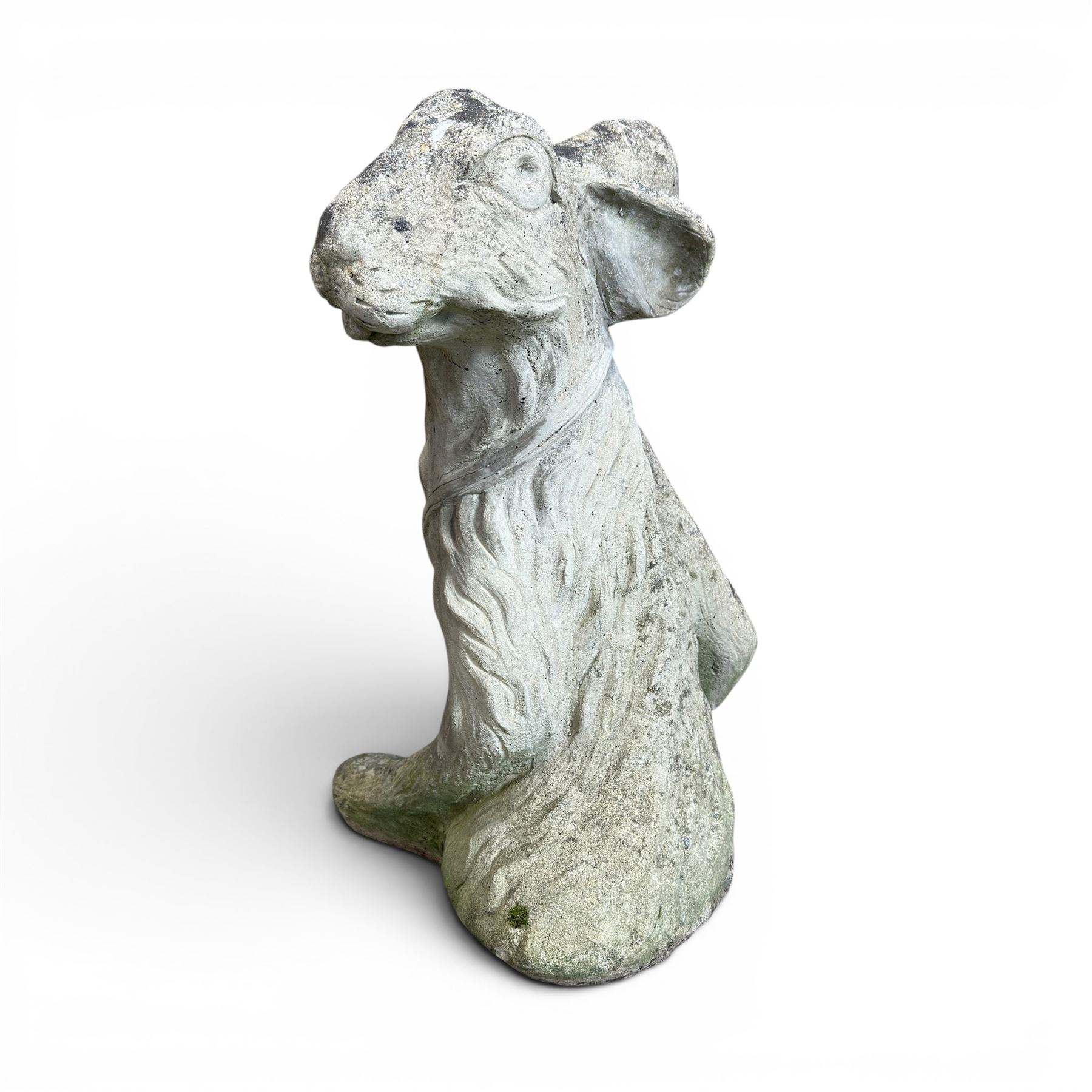 Two weathered cast stone garden hares